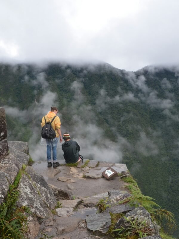 Death Stairs of Huayna Picchu with hikers overlooking the ancient Inca city of Machu Picchu, Peru
