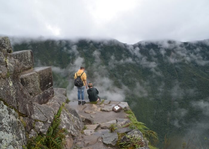 Death Stairs of Huayna Picchu with hikers overlooking the ancient Inca city of Machu Picchu, Peru