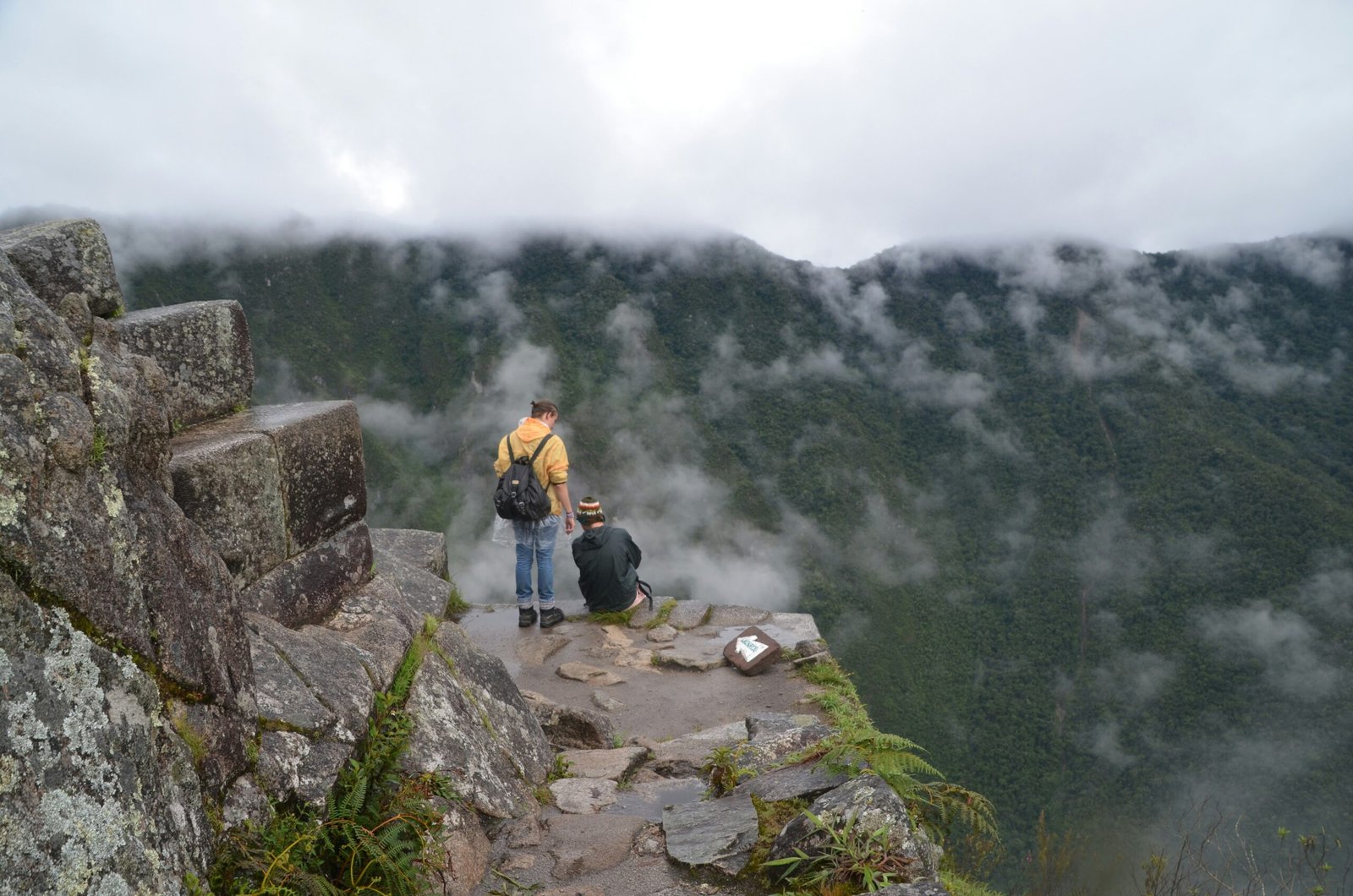 Death Stairs of Huayna Picchu with hikers overlooking the ancient Inca city of Machu Picchu, Peru