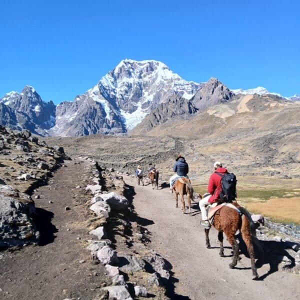 Hiking the 7 Lakes of Ausangate — a breathtaking day tour from Cusco surrounded by turquoise lagoons and snow-capped peaks in the Andes.