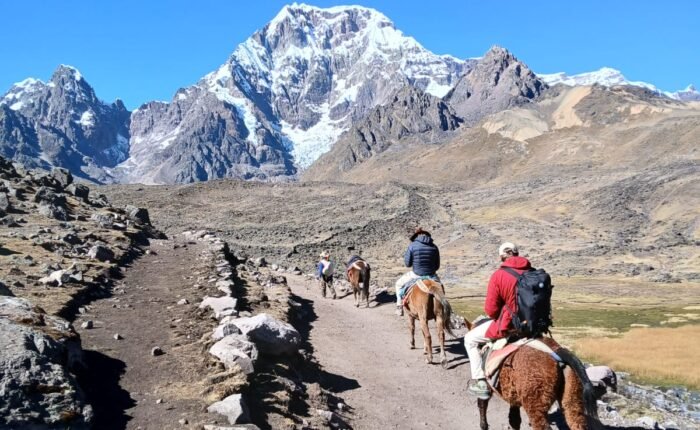 Hiking the 7 Lakes of Ausangate — a breathtaking day tour from Cusco surrounded by turquoise lagoons and snow-capped peaks in the Andes.
