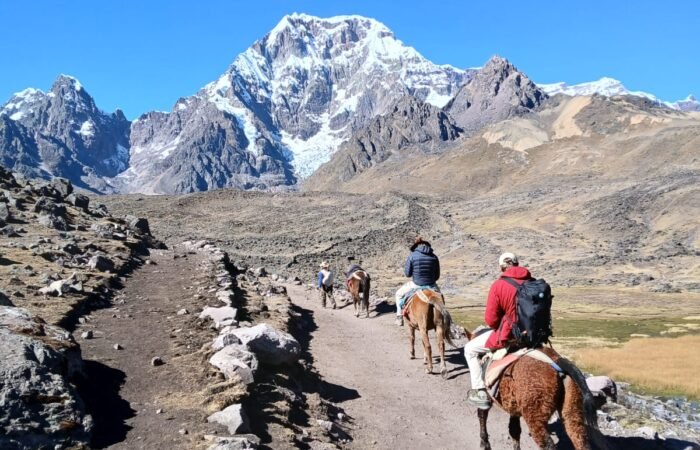 Hiking the 7 Lakes of Ausangate — a breathtaking day tour from Cusco surrounded by turquoise lagoons and snow-capped peaks in the Andes.