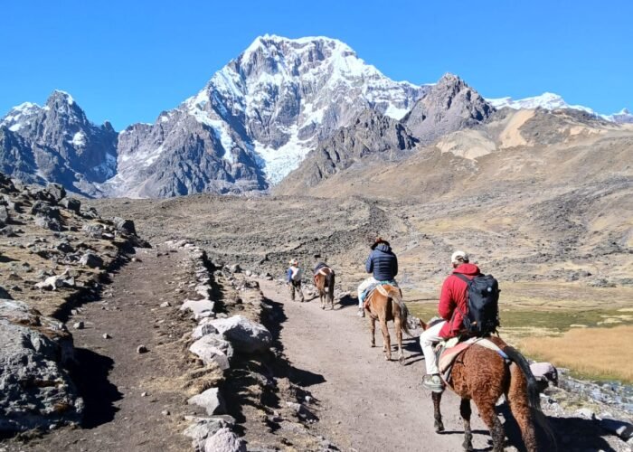 Hiking the 7 Lakes of Ausangate — a breathtaking day tour from Cusco surrounded by turquoise lagoons and snow-capped peaks in the Andes.