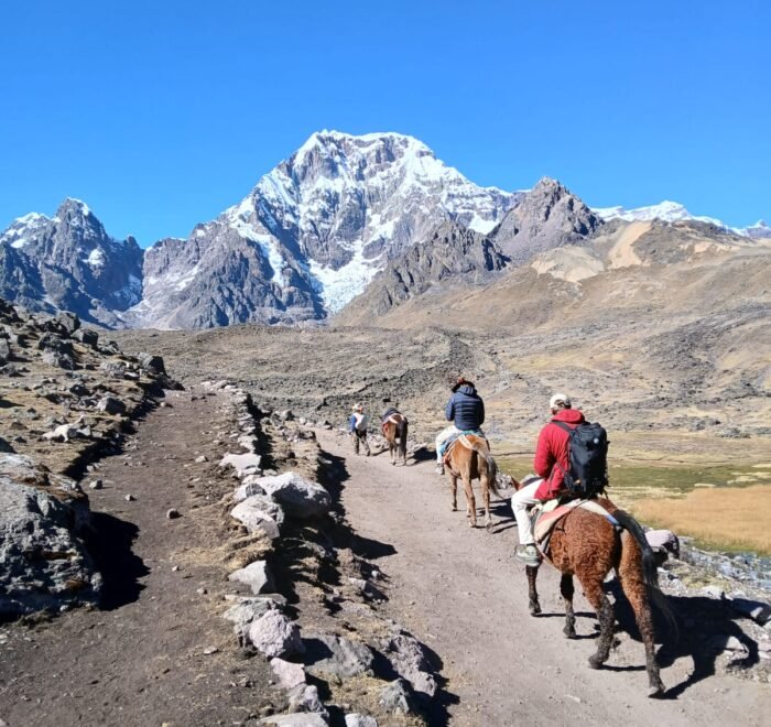 Hiking the 7 Lakes of Ausangate — a breathtaking day tour from Cusco surrounded by turquoise lagoons and snow-capped peaks in the Andes.