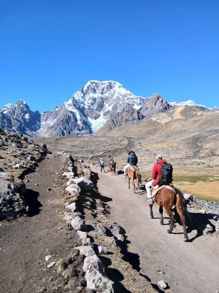 Hiking the 7 Lakes of Ausangate — a breathtaking day tour from Cusco surrounded by turquoise lagoons and snow-capped peaks in the Andes.